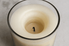 Close-up of candle tunneling showing unmelted wax around the edges and a deep tunnel around the wick.