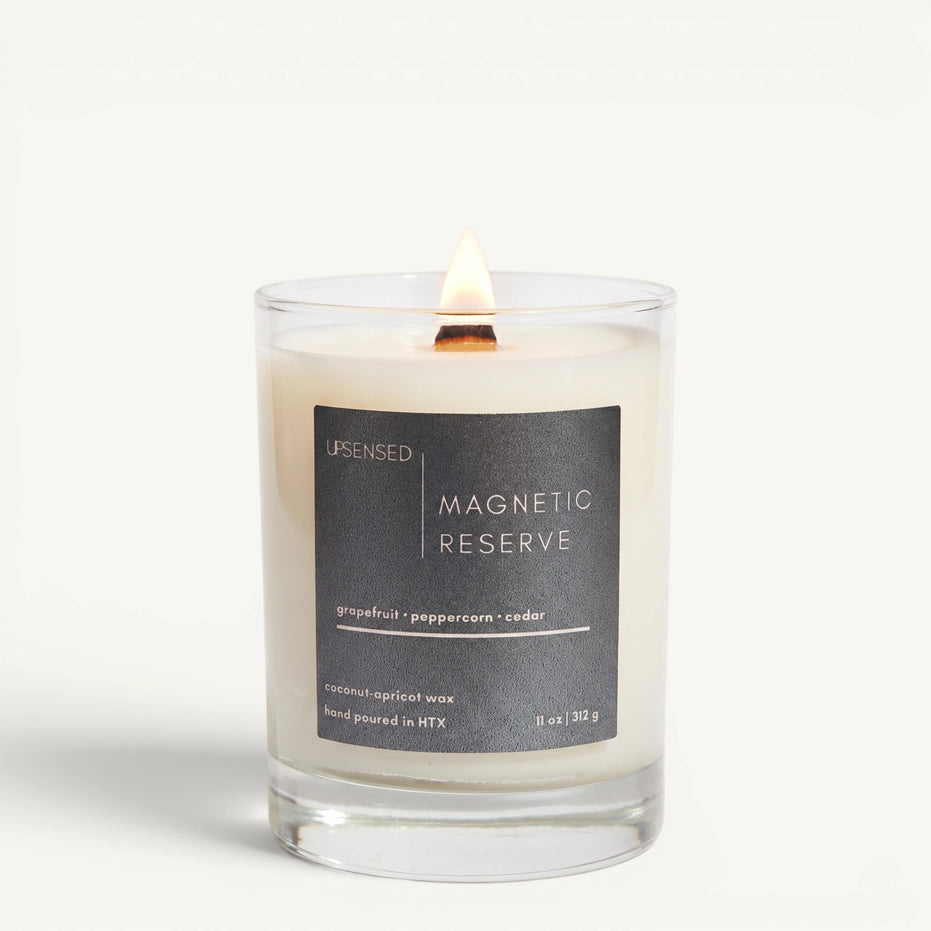 Upsensed Magnetic Reserve 11oz scented candle burning with wood wick - grapefruit peppercorn and cedar coconut apricot wax candle hand poured in Houston