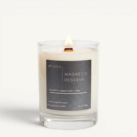 Upsensed Magnetic Reserve 11oz scented candle burning with wood wick - grapefruit peppercorn and cedar coconut apricot wax candle hand poured in Houston