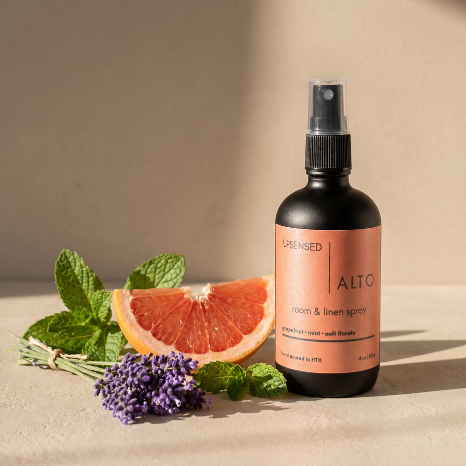 Upsensed Alto room and linen spray with fresh grapefruit, mint, and lavender on a warm neutral surface