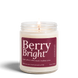 Upsensed Berry Bright 8 oz soy candle, lit, in a clear glass jar with a deep berry label listing sugar plum, white musk, and mulled citrus