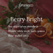 Berry Bright fragrance notes graphic over sugared plums in a crystal dish, a halved blood orange, mandarins, and a glass of mulled citrus on a deep pink table. Top notes sugar plum, mandarin; middle notes white musk, leafy greens; base note mulled citrus.
