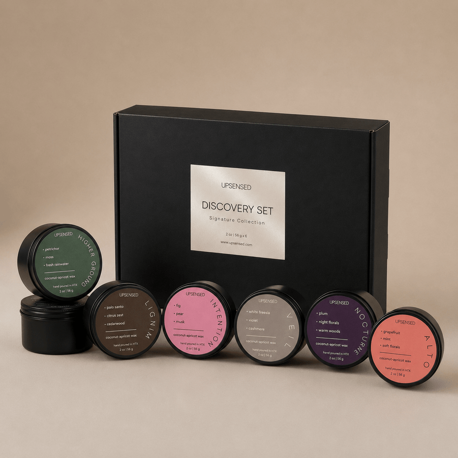 Upsensed Discovery Set Signature Collection black gift box with all 6 mini candles displayed in front — Higher Ground, Lignum, Intention, Veil, Nocturne, and Alto 2 oz hand-poured coconut-apricot wax candles