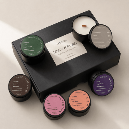 Upsensed Discovery Set Signature Collection black gift box surrounded by 6 mini candles — Higher Ground, Lignum, Intention, Alto, Nocturne, and Veil, hand poured in Houston with coconut-apricot wax