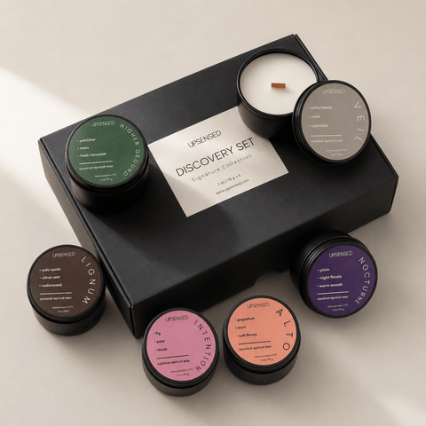 Upsensed Discovery Set Signature Collection black gift box surrounded by 6 mini candles — Higher Ground, Lignum, Intention, Alto, Nocturne, and Veil, hand poured in Houston with coconut-apricot wax