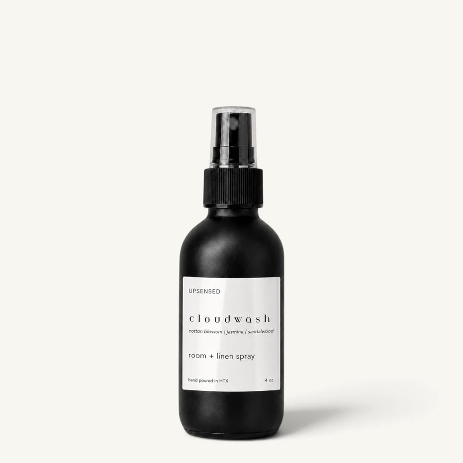 Upsensed Cloudwash room and linen spray in a matte black 4 oz bottle with white label