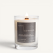 Upsensed Cortado candle lit on white background, showing charcoal label with coffee bean, cinnamon, and cream notes