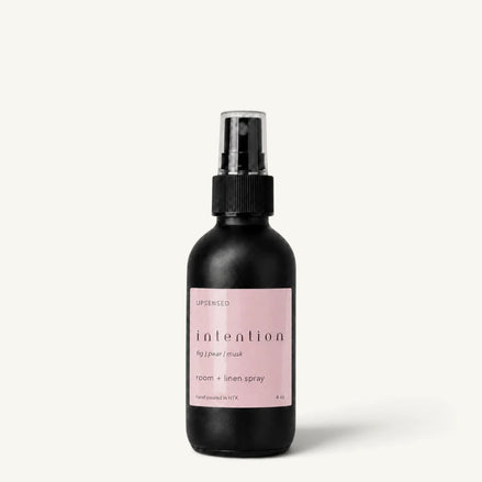 Upsensed Intention room and linen spray in a matte black 4 oz bottle with soft pink label
