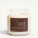 Upsensed Leather + Tabac 16 oz double-wick candle in a clear apothecary jar with a dark brown label, suede silk, leather, tobacco, and cherrywood scent notes, on a plain white background.