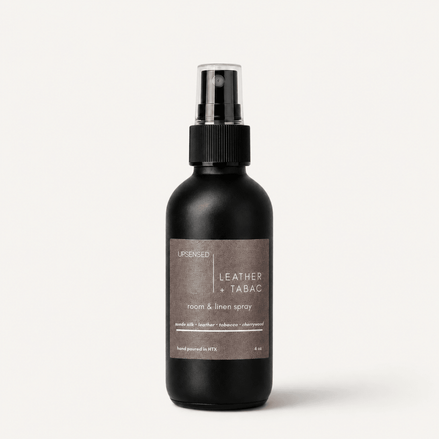 Upsensed Leather + Tabac room and linen spray, 4 oz black bottle with suede silk, leather, tobacco and cherrywood scent notes