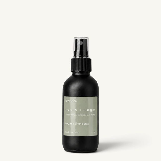 Upsensed Moss + Sage room and linen spray in a matte black 4 oz bottle with sage green label