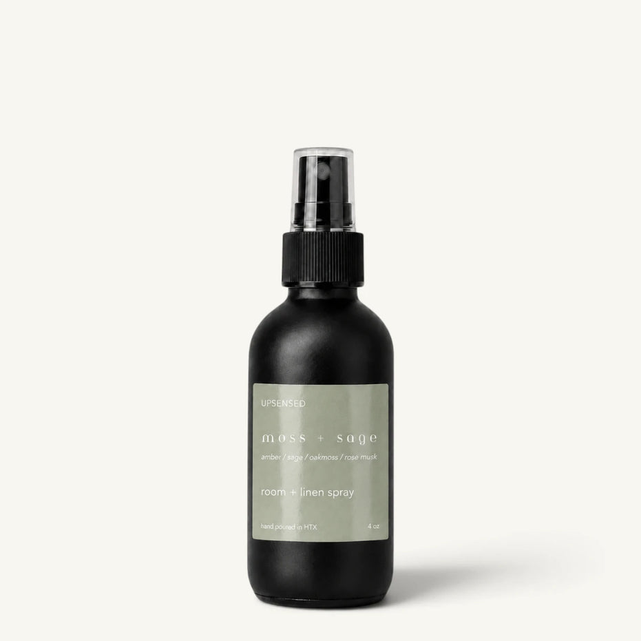 Upsensed Moss + Sage room and linen spray in a matte black 4 oz bottle with sage green label