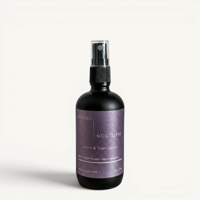 Upsensed Nocturne 4oz Room and Linen Spray in matte black bottle with deep purple label - plum night florals and warm woods linen spray hand poured in Houston