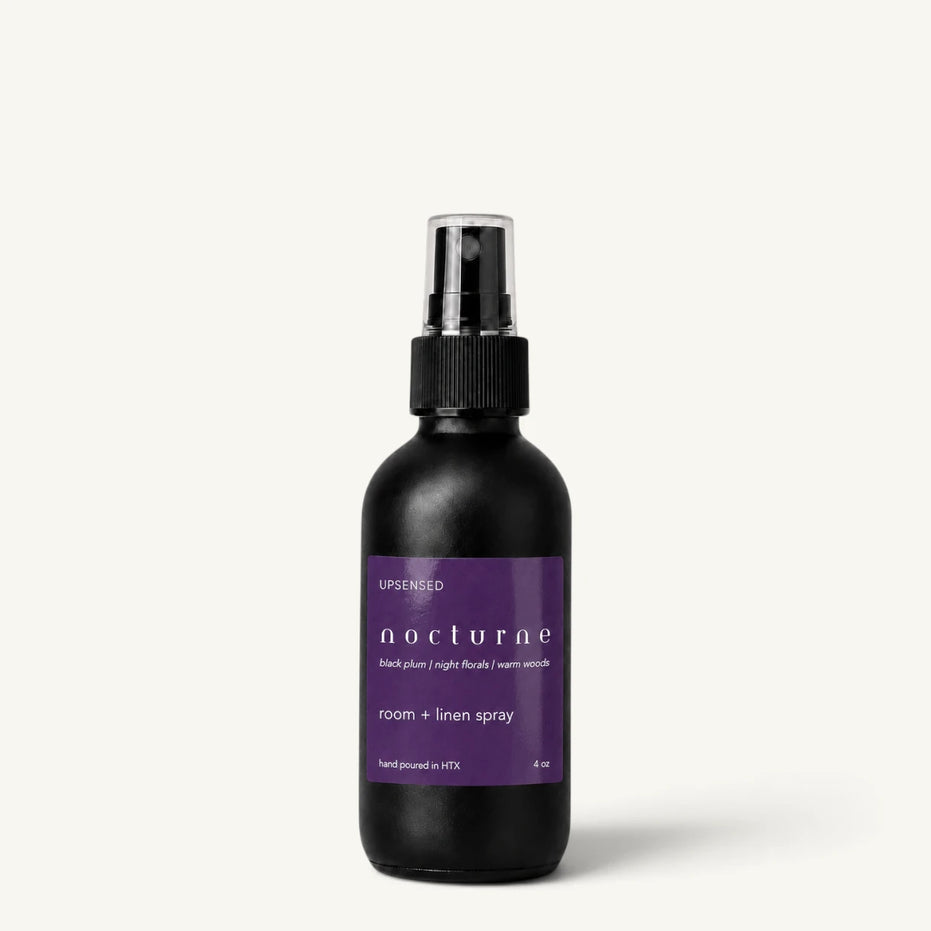 Upsensed Nocturne room and linen spray in a matte black 4 oz bottle with deep purple label