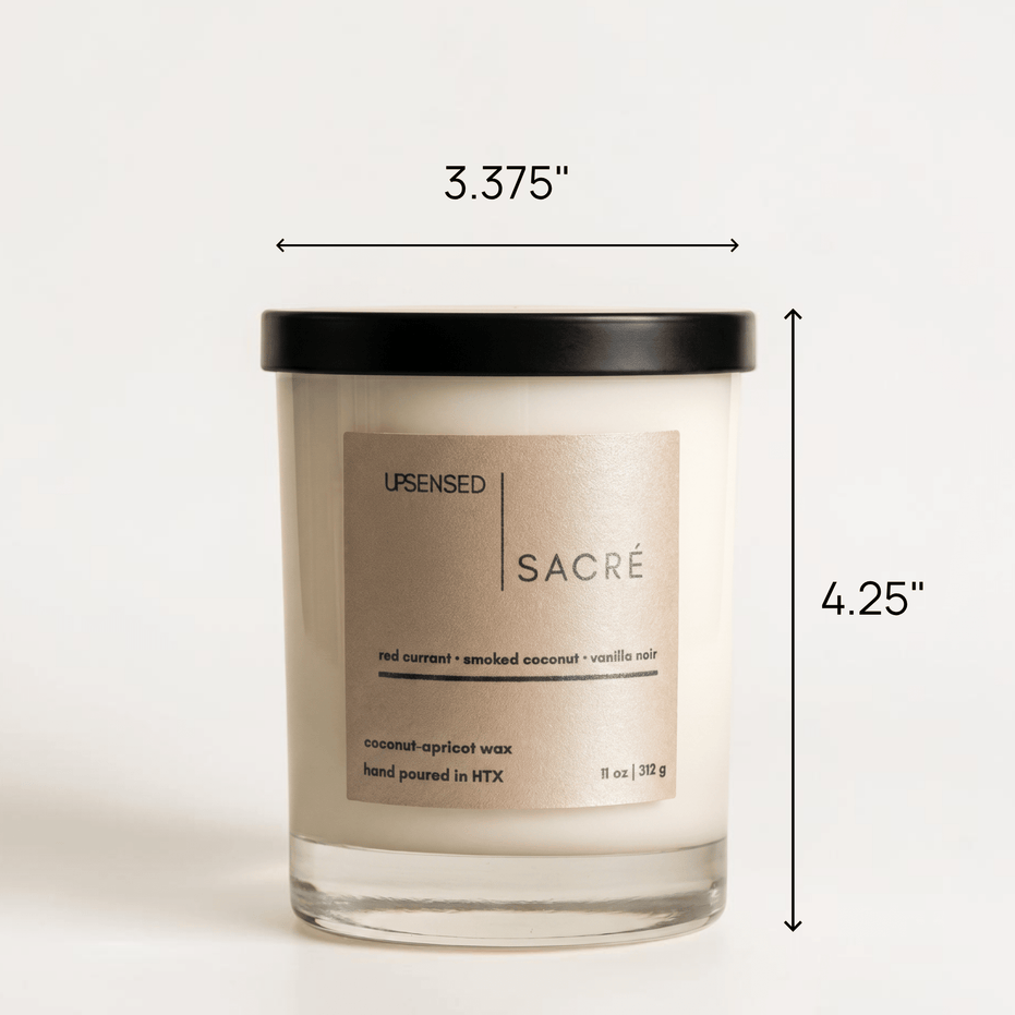 Upsensed Sacré candle with black lid showing dimensions — 3.375 inches wide by 4.25 inches tall