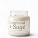 Upsensed Shortbread + Sage 18 oz double-wick soy candle, lit, in a clear apothecary jar with a cream label and sage green lettering listing buttery shortbread, wild sage, and candied pecan