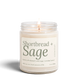 Upsensed Shortbread + Sage 8 oz soy candle, lit, in a clear glass jar with a cream label and sage green lettering listing buttery shortbread, wild sage, and candied pecan