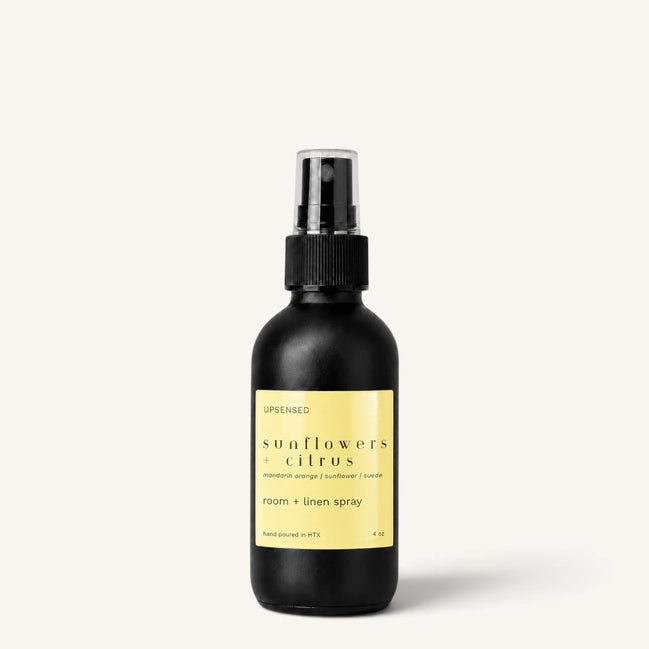 Upsensed Sunflowers + Citrus room and linen spray in a matte black 4 oz bottle with yellow label