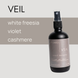 Veil room and linen spray by Upsensed — white freesia, violet, and cashmere scent in 4oz black bottle