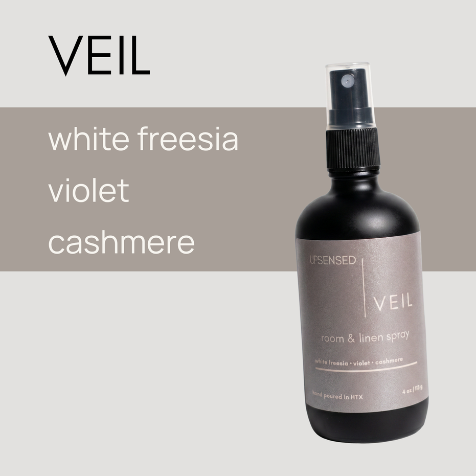 Veil room and linen spray by Upsensed — white freesia, violet, and cashmere scent in 4oz black bottle