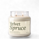 Upsensed Velvet Spruce 18 oz double-wick soy candle, lit, in a clear apothecary jar with an ivory label and deep green lettering listing spruce, custard, vanilla, and sandalwood